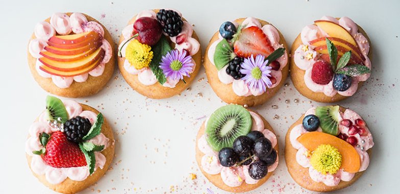 Assorted donuts top of white area in Cheapest price